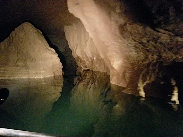 riding in a boat in Bluespring Caverns