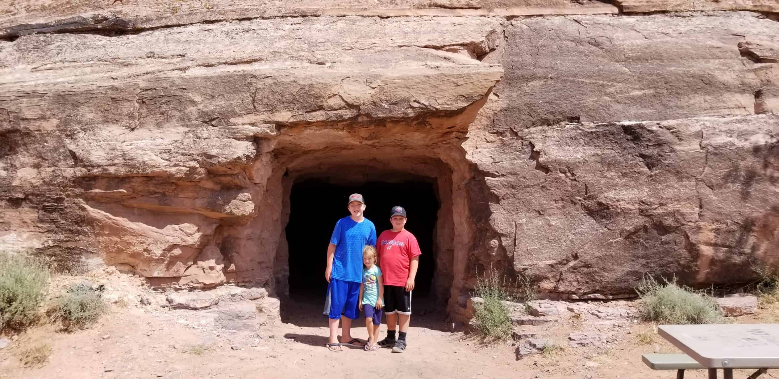 kids in front of cave in Moab Utah