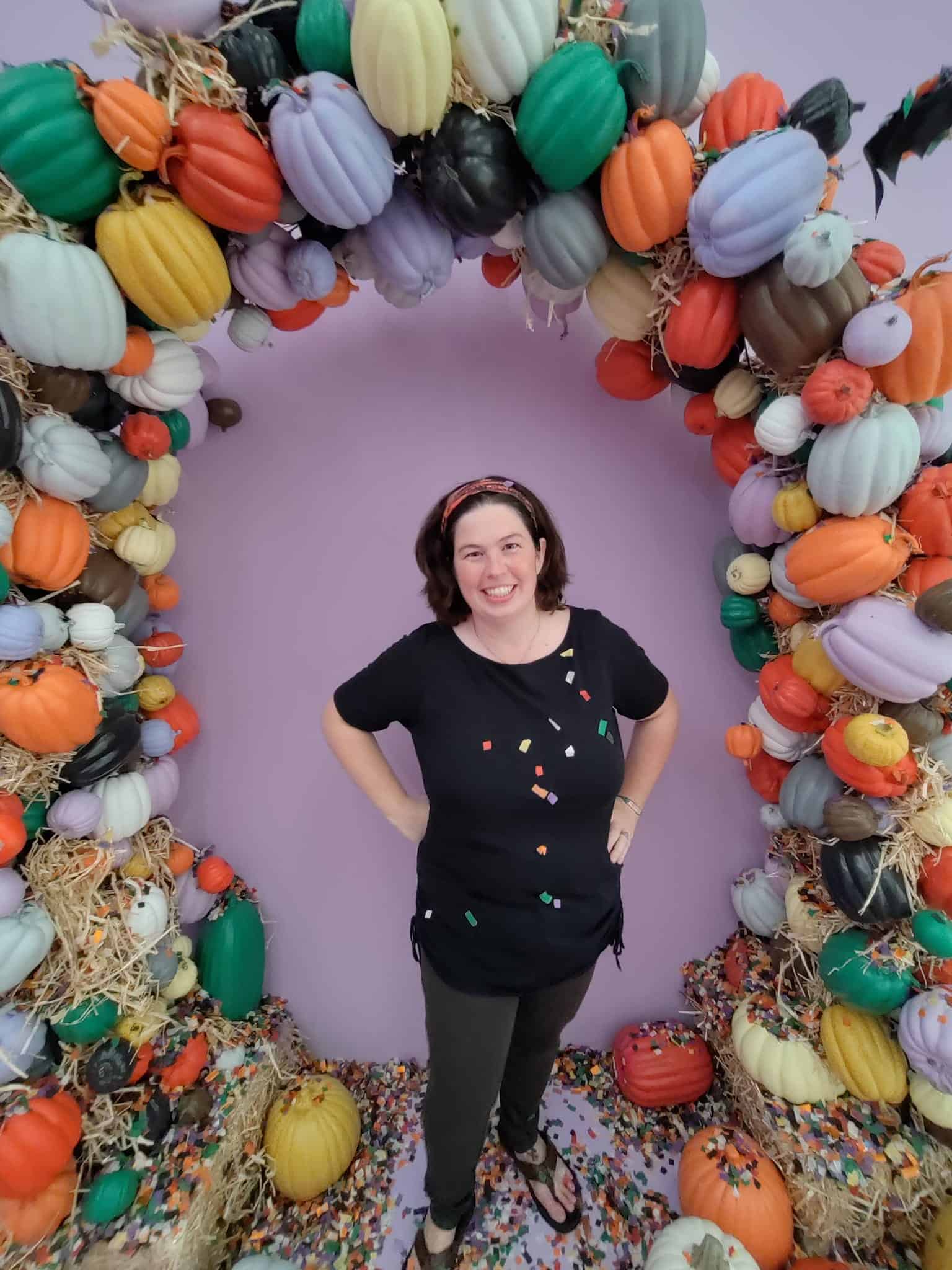 lady posing in pumpkin art Color Factory in Houston